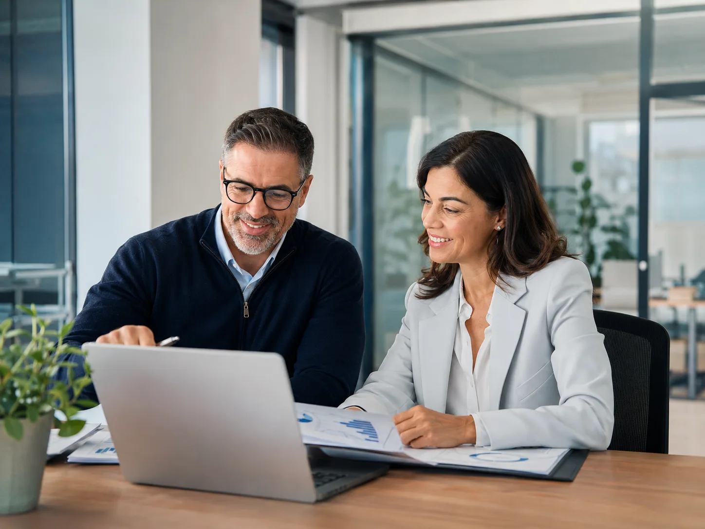 Business leader and IT professional reviewing a cybersecurity readiness plan together